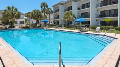 a large swimming pool in front of a building at Emerald Hill 23 - The Little Pearl in Santa Rosa Beach