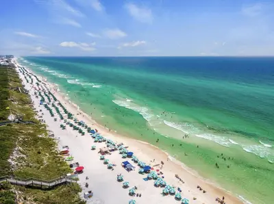 an overhead view of a beach with umbrellas and the ocean at FL(S) - The Oxford - 10343 E Co Hwy 30A Unit 410 in Inlet Beach
