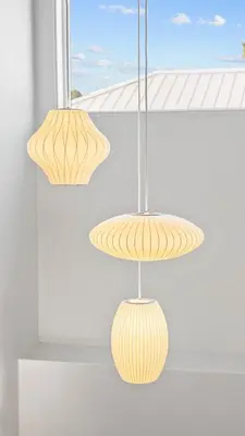 two light fixtures are hanging from a ceiling at Seagrove Surf Shack in Santa Rosa Beach