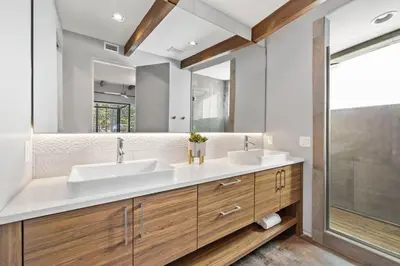a bathroom with two sinks and a large mirror at Seagrove Surf Shack in Santa Rosa Beach
