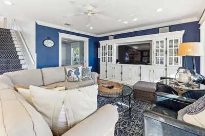 a living room with a couch and a tv at Diamond Dunes in Inlet Beach