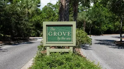 a sign that says the grove by the yard at Magnolia Breeze in Santa Rosa Beach