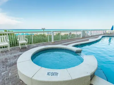 a swimming pool with a no entry sign next to the ocean at Seychelles #203 in Panama City Beach