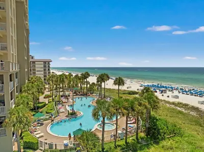 an aerial view of a resort with a swimming pool and the beach at Grand Panama Beach Resort - Pet Friendly Condos by Panhandle Getaways in Panama City Beach