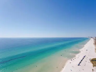 an aerial view of a beach with people and the ocean at Seychelles 2107 - The Osprey at Seychelles Resort in Panama City Beach