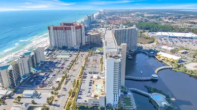 an aerial view of the beach and buildings at Sea Turtle at Laketown Wharf in Panama City Beach