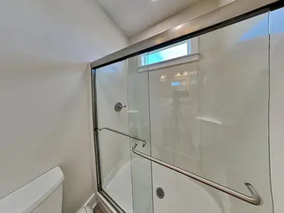 a shower with a glass door in a bathroom at Horizon Dreams A in Panama City Beach