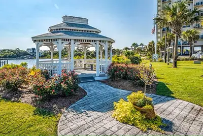 a gazebo in a park next to a building at Sunshine at PP A-914 in Panama City Beach