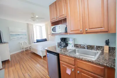 a kitchen with a sink and a counter top at Splash 1701E in Panama City Beach