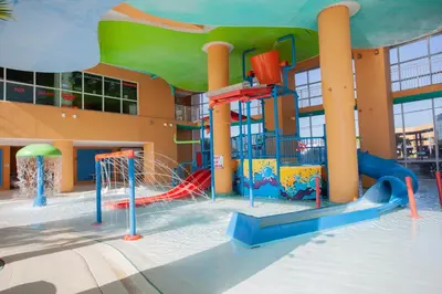 a playground in front of a building at Splash 1701E - Studio in Panama City Beach