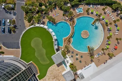 an overhead view of a pool at a resort at 3 BD Gulf View Resort Condo! 5 Pools! Beach Access by Dolce Vita Getaways in Panama City Beach