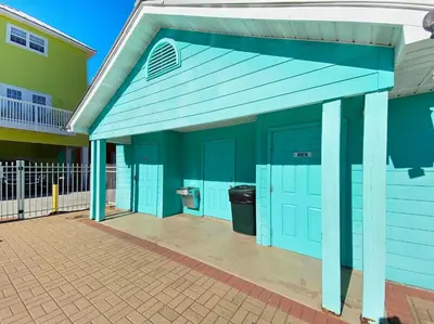 a blue building with a toilet in it at SummerTowne 1 At Pier Park l Amazing Ocean Views l Dog Friendly l Community Pool in Panama City Beach
