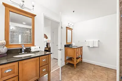 a bathroom with a sink and a mirror at Sterling Breeze 307B by Emerald Coast Retreats in Panama City Beach
