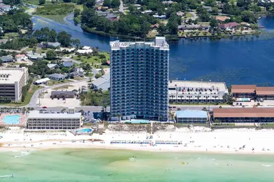 an aerial view of a beach with a tall building at Sterling Breeze 307B by Emerald Coast Retreats in Panama City Beach