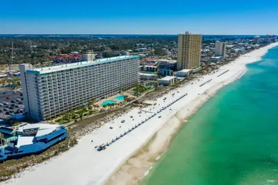 an aerial view of a beach with a hotel and the ocean at Summit 1417 Beach Resort - Amazing Balcony Views in Panama City Beach