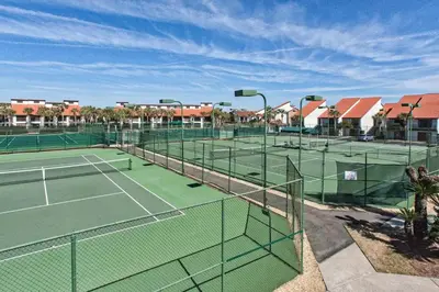 a tennis court with four tennis courts at Edgewater Tower 3-1003 in Panama City Beach