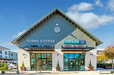 a tinto coffee building with a sign on it at You are my Sunshine- Heated Pool- Steps to sand in Santa Rosa Beach