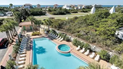 an aerial view of a swimming pool with chairs and a resort at The Inn at Seacrest Beach Unit 207 in Rosemary Beach