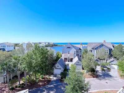 an aerial view of a house with a lake at Watersound 13 in Watersound Beach