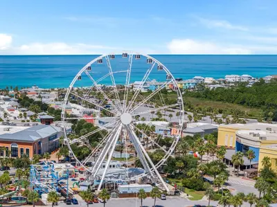 an amusement park with a ferris wheel and the ocean at Pet Friendly Beach House - Beachside Sunrise in Panama City Beach