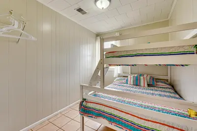 a bunk room with two bunk beds in it at Two by Sea Beachfront Private Home with Courtyard! in Panama City Beach