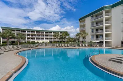 a swimming pool in front of a resort at 4th-floor condo with beach ambience lagoon pool gym tennis & pickleball in Santa Rosa Beach