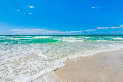 a view of the ocean from the beach at Airy beachfront condo with balcony views lagoon pool tennis & pickleball in Seacrest