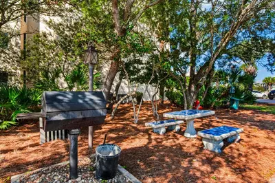 a park with a piano and a picnic table at Beautiful 3rd-floor villa with hot tub tennis pickleball & balcony with views in Seacrest