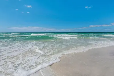 a view of the ocean from the beach at Gorgeous beach condo with furnished balcony panoramic view & pickleball in Seacrest