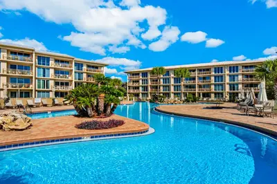 an image of a pool at a resort at Beachfront condo with 2 beach chairs included & pickleball - short walk to dining in Seacrest