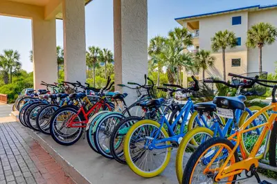 a row of bikes parked next to a building at Beach dwelling with great view pool & pickleball - snowbird-friendly in Seacrest