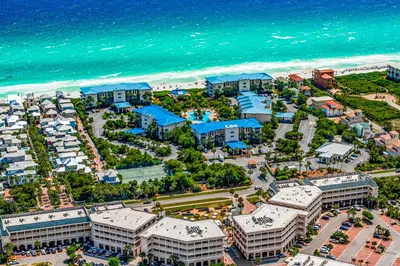 an aerial view of a resort near the beach at Beach haven with patio lagoon pool hot tub & pickleball - walk to beach in Seacrest