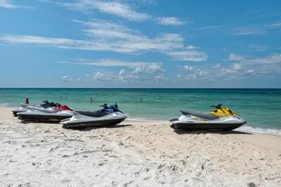 a row of motorcycles parked on the beach at Calypso 2-1907 West in Panama City Beach