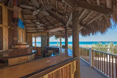 a porch of a resort with the beach in the background at Calypso 2-1907 West in Panama City Beach