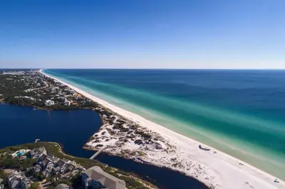 an aerial view of a beach and the ocean at Prominence on 30A Vacation Homes in Watersound Beach