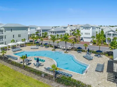 an aerial view of a swimming pool at a resort at Prominence on 30A by Panhandle Getaways in Watersound Beach