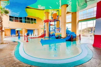 a water park with a water slide in a building at Splash 1505E in Panama City Beach