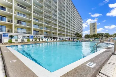 a large swimming pool in front of a building at The Summit 502 in Panama City Beach