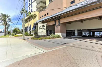 an empty street in front of a building at Coastal Florida Abode with Pool Access and Ocean Views in Panama City Beach