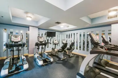 a gym with several cardio machines in a room at Calypso 2-2304 West in Panama City Beach