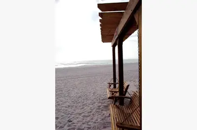 a view of the beach from the porch of a beach house at Sunbird 0208W 'Surfside Sandcastle' in Panama City Beach