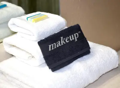 a stack of towels with a sign on them at Origin 631 'Sea La Vie' in Panama City Beach