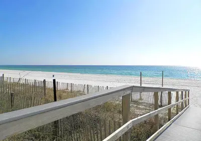 a wooden boardwalk leading to a beach with the ocean at Grandview East 304 in Panama City Beach