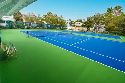 an image of a tennis court with a bench on it at Cassine Dream in Santa Rosa Beach