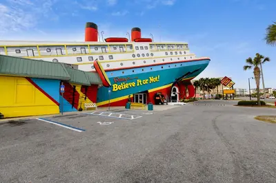 a large cruise ship parked in a parking lot at Poolside Cabana by Book That Condo in Panama City Beach