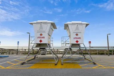two lifeguard stations sitting in a parking lot at Shores of Panama #1411 by Book That Condo in Panama City Beach