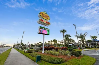 a sign for a fast food restaurant on a street at Shores of Panama #2201 by Book That Condo in Panama City Beach