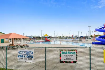 a view of an empty water park behind a fence at Calypso Resort and Towers #602-E by Book That Condo in Panama City Beach