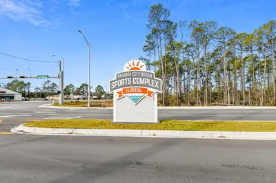 a sign for a store on the side of a road at Calypso Resort and Towers #602-E by Book That Condo in Panama City Beach