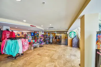 a store with a lot of clothes on display at Emerald Beach #636 by Book That Condo in Panama City Beach